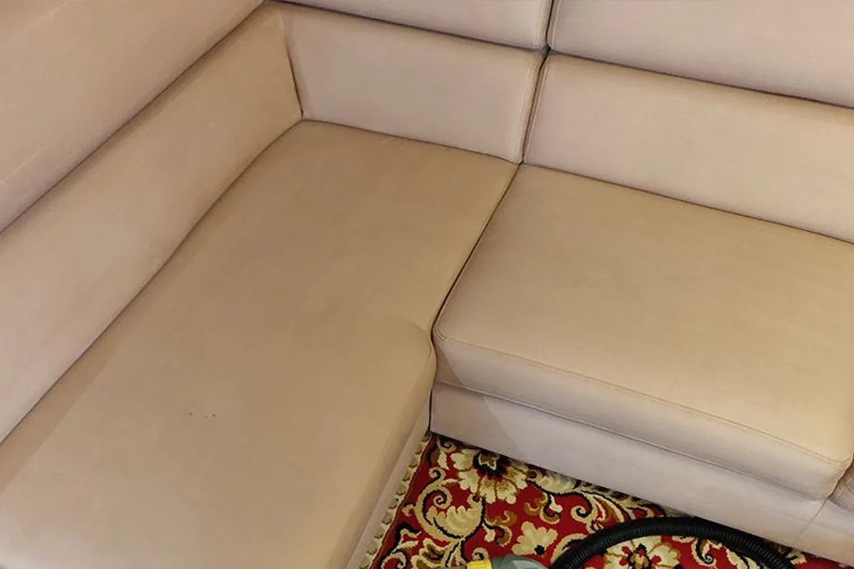 Beige corner lounge, ground-in soil across the seats — after cleaning by SevenClean