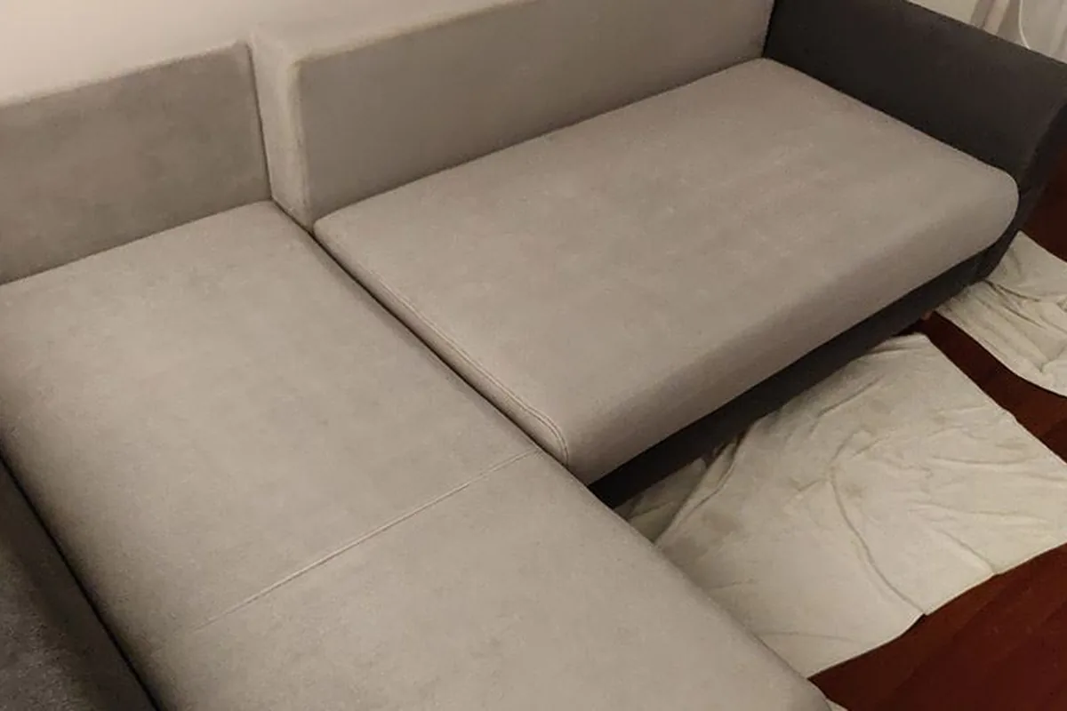 Grey sofa with spill stains on the chaise — after cleaning by SevenClean
