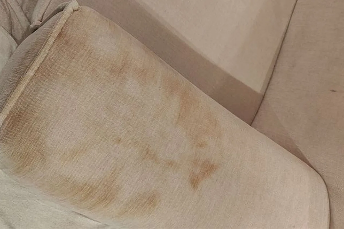 Sofa arm and back, heavy edge soiling — before cleaning