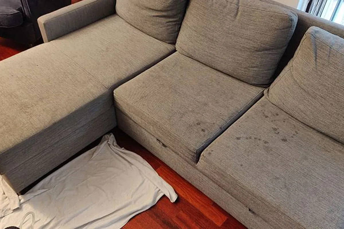 Large corner lounge, whole-piece clean — before cleaning